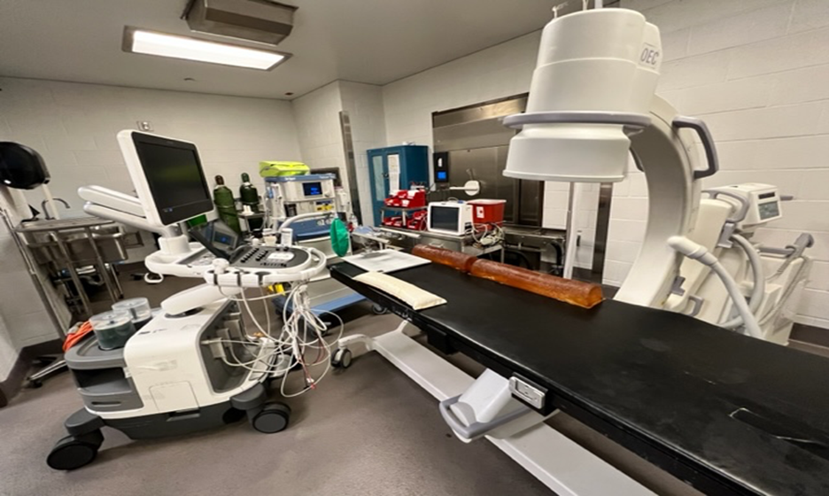 A medical room with a machine and other equipment.